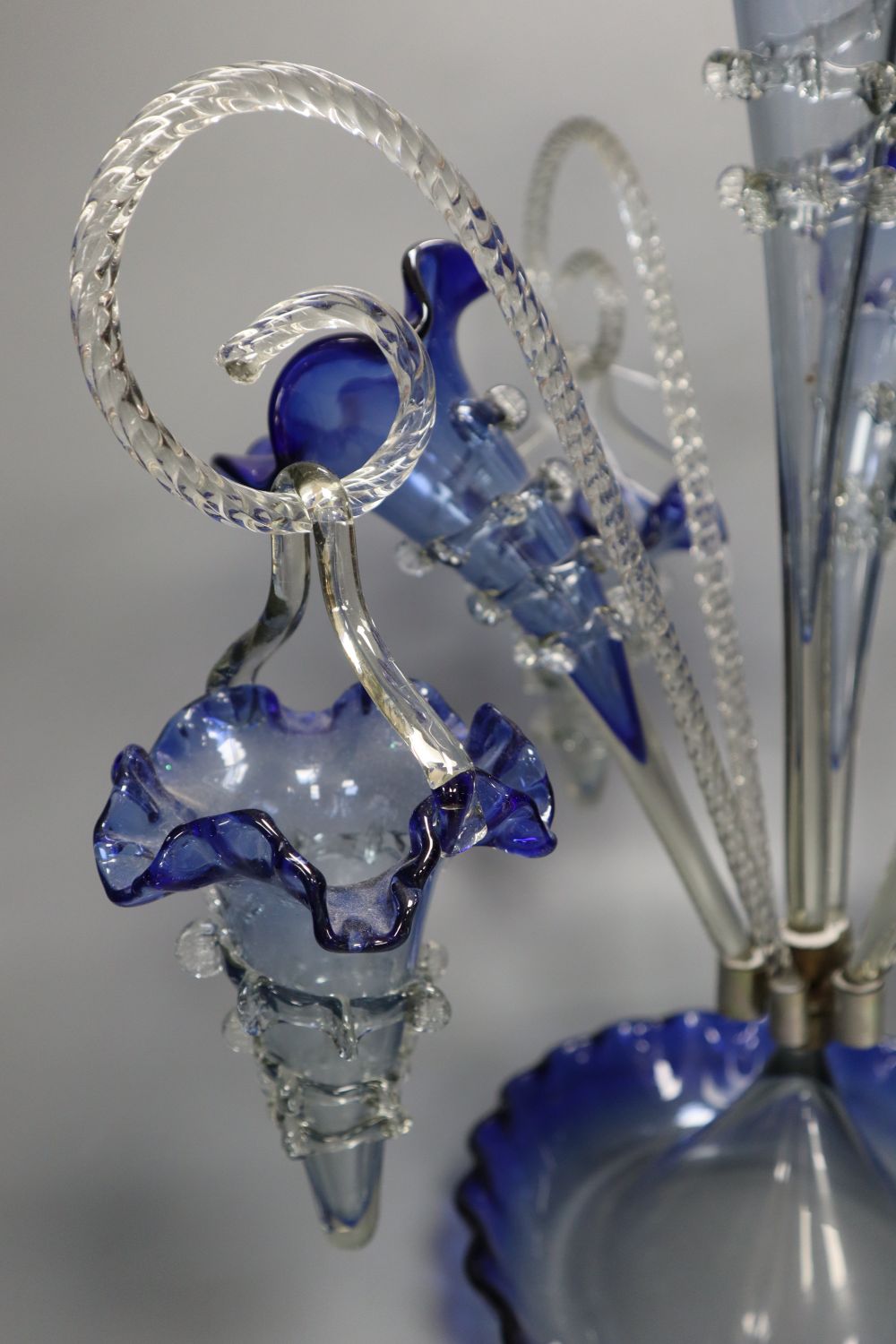 A Victorian blue and clear glass epergne, with trailed glass ornament, 49cm